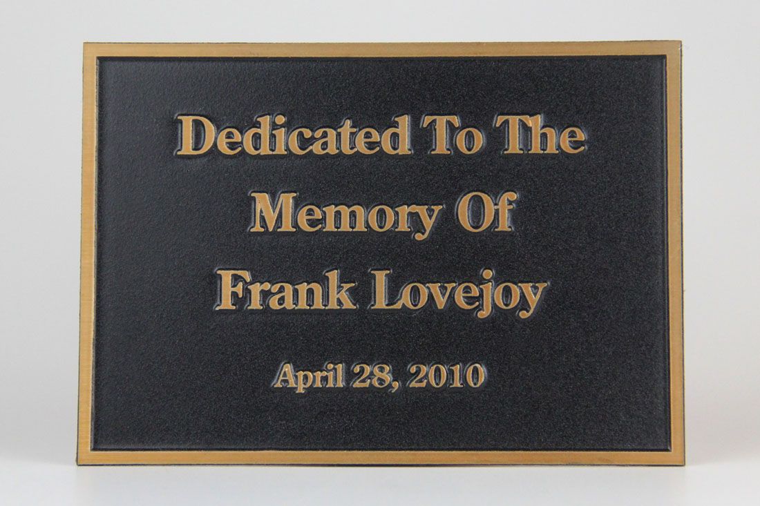 Black and gold memorial plaque with custom copy