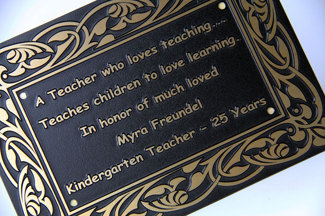 Custom designed plaque with a gold frame and intricate design